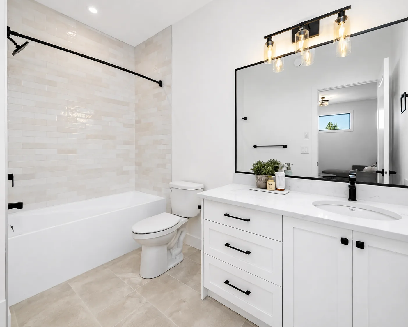 Black-framed rectangular mirror above a double vanity