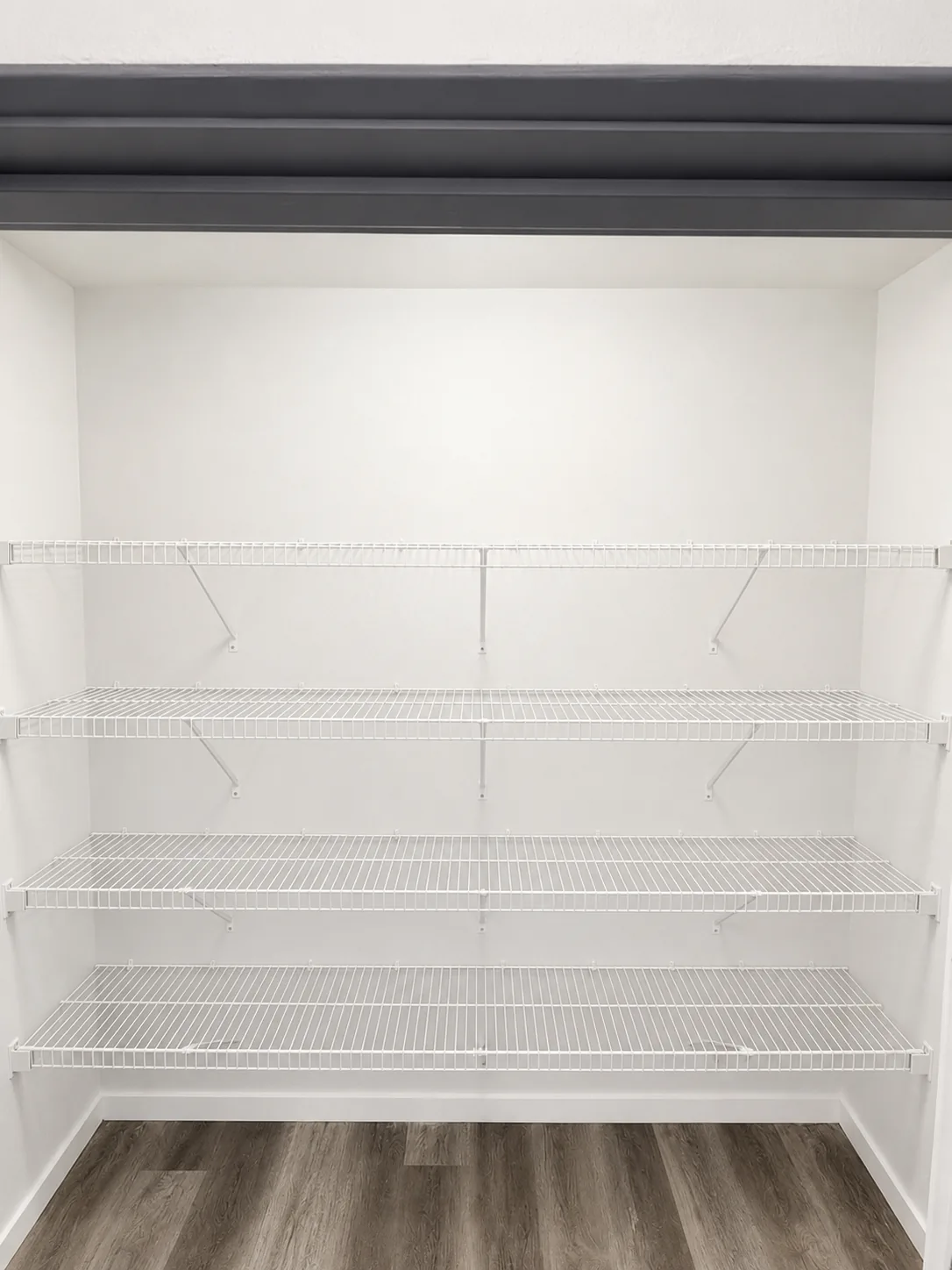 White wire pantry shelving wall